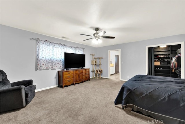 carpeted bedroom featuring ceiling fan and a closet