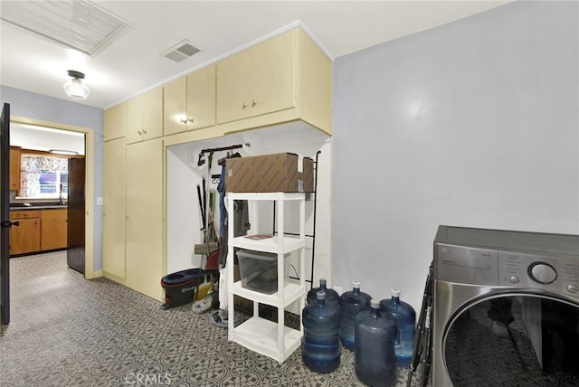 1938 Colusa, Corning, CA 96021 - laundry area with washer / clothes dryer, cabinet space, and light floors