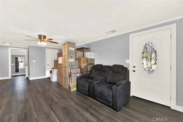 living room with dark hardwood / wood-style floors, ceiling fan, and crown molding