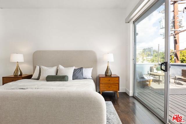 bedroom with access to outside and dark wood-type flooring