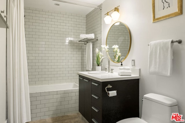 full bathroom with tile patterned flooring, vanity, shower / bath combination with curtain, and toilet