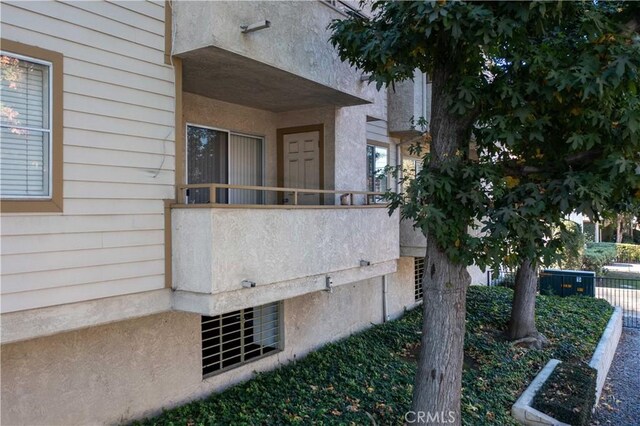 view of property exterior featuring a balcony