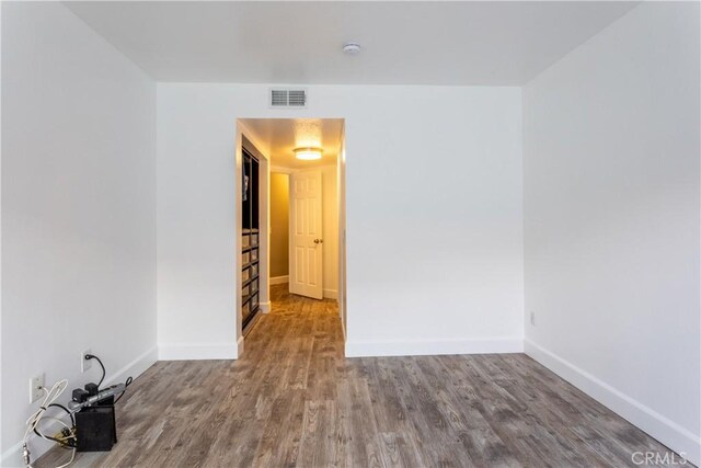 spare room featuring hardwood / wood-style flooring