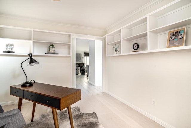 home office with hardwood / wood-style floors and crown molding