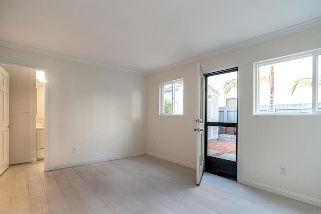 interior space with light hardwood / wood-style floors and ornamental molding