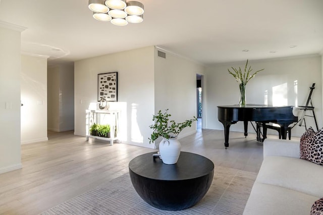 interior space with light wood-type flooring and ornamental molding