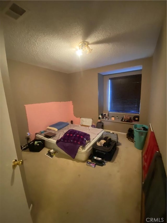 bedroom with a textured ceiling