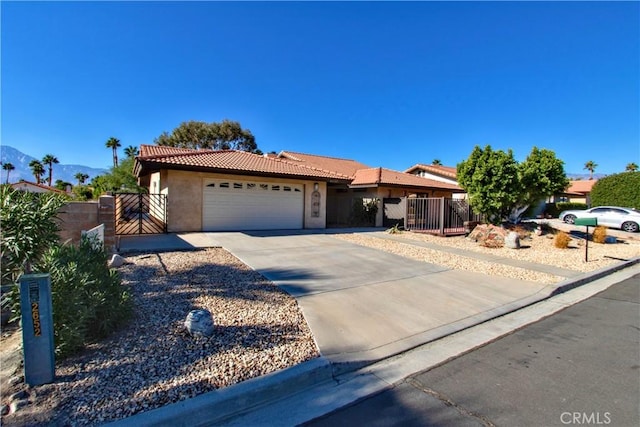 view of front of property featuring a mountain view and a garage