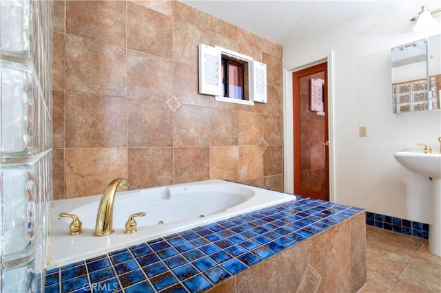 bathroom featuring tiled bath and tile patterned floors