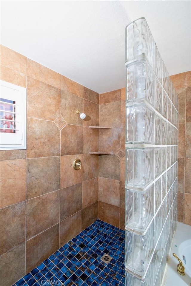 bathroom with separate shower and tub, tile patterned flooring, and tile walls