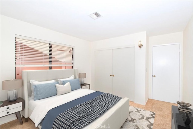 carpeted bedroom featuring a closet