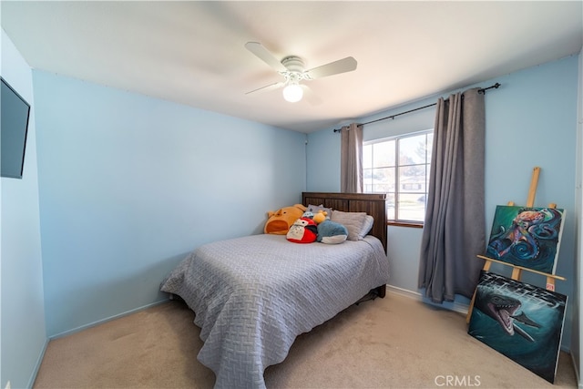 bedroom featuring ceiling fan and light carpet