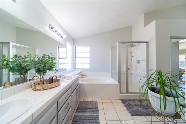 bathroom featuring tile patterned floors, vanity, lofted ceiling, and shower with separate bathtub