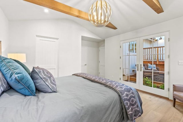 bedroom with multiple windows, light wood-type flooring, french doors, and vaulted ceiling with beams