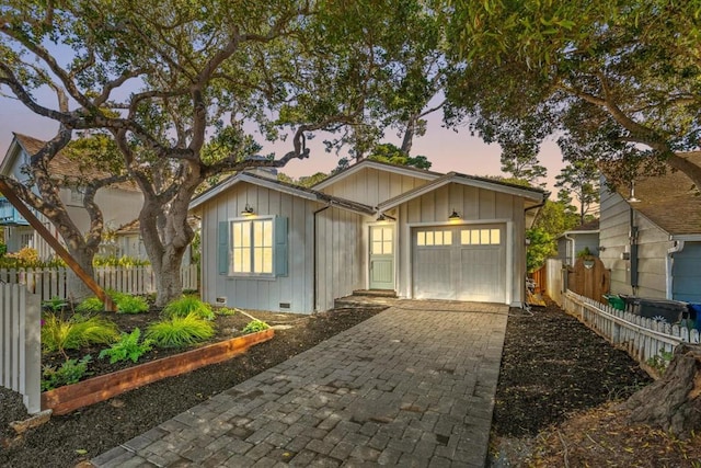 view of front of property with a garage