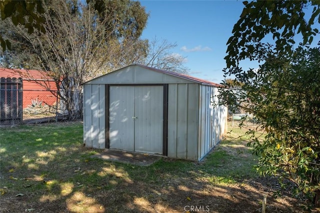 view of outdoor structure with a lawn