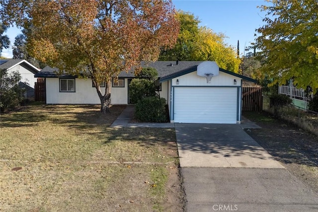 view of front of house featuring a garage and a front yard