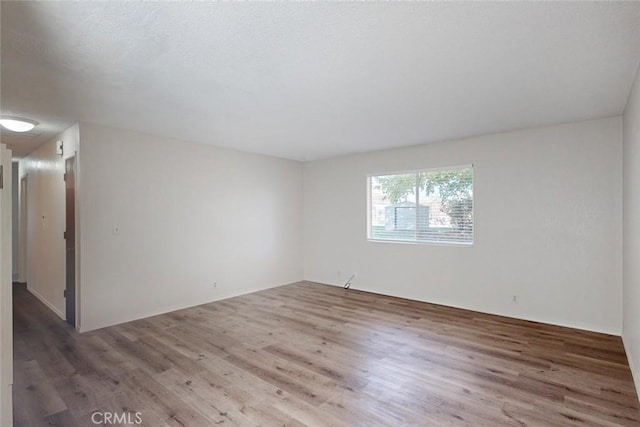 unfurnished room featuring dark hardwood / wood-style floors