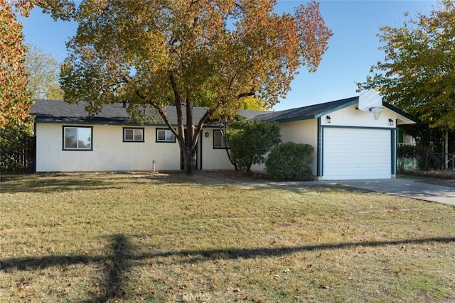 ranch-style home featuring a garage and a front yard