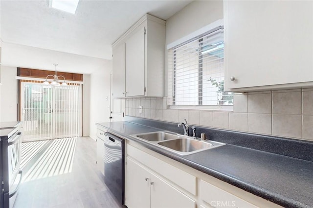 kitchen featuring white cabinetry, sink, stainless steel dishwasher, light hardwood / wood-style floors, and decorative backsplash