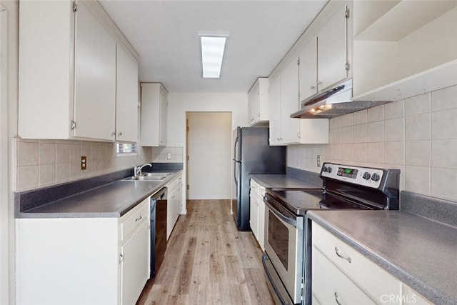 kitchen featuring white cabinets, stainless steel appliances, and light hardwood / wood-style flooring