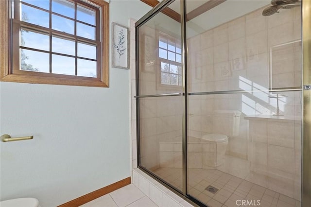 bathroom featuring plenty of natural light, an enclosed shower, and tile patterned flooring