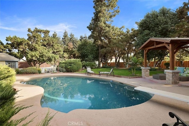 view of swimming pool with a gazebo, a diving board, and a patio area