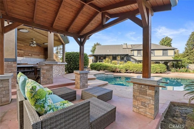 view of patio with ceiling fan and an outdoor hangout area