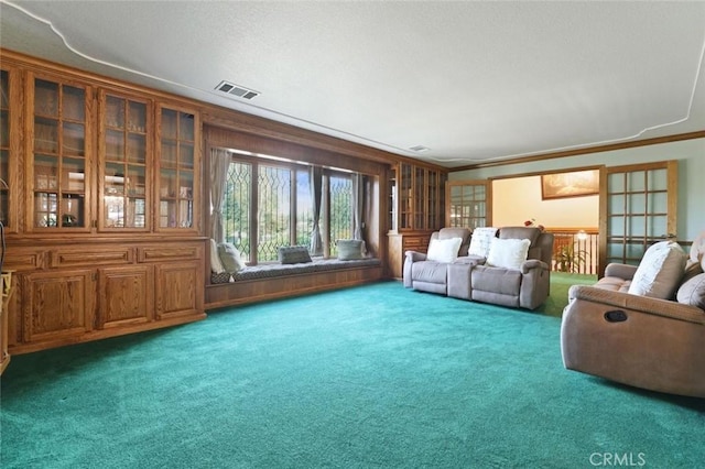 carpeted living room featuring ornamental molding