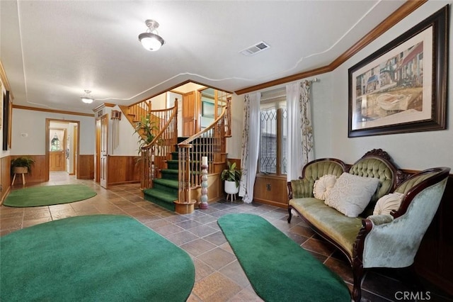 interior space featuring ornamental molding and wooden walls