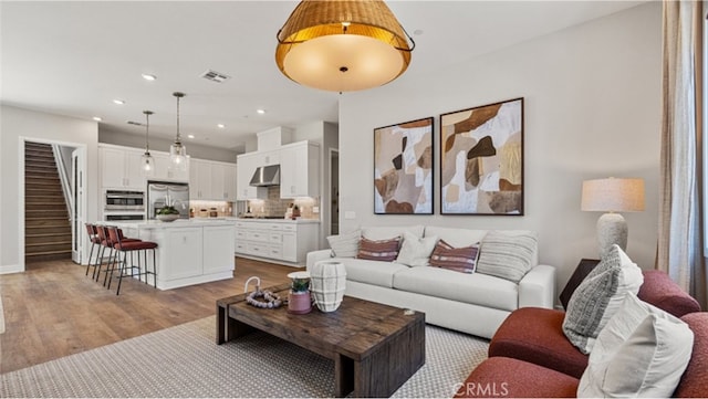 living room with light hardwood / wood-style floors