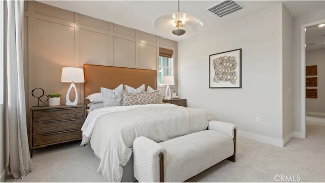 bedroom featuring light colored carpet