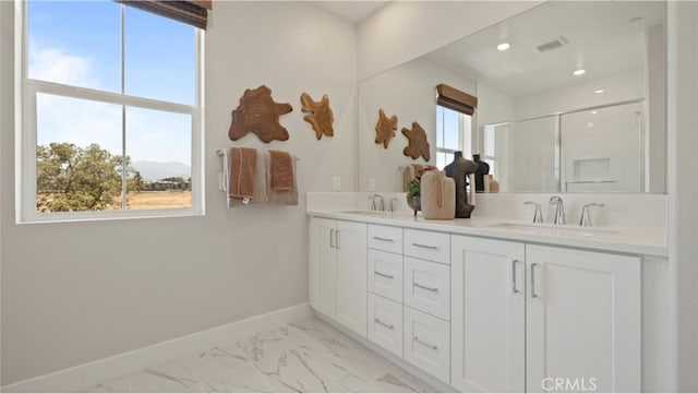 bathroom with vanity and an enclosed shower