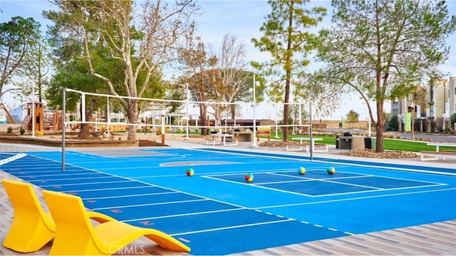 view of tennis court featuring volleyball court