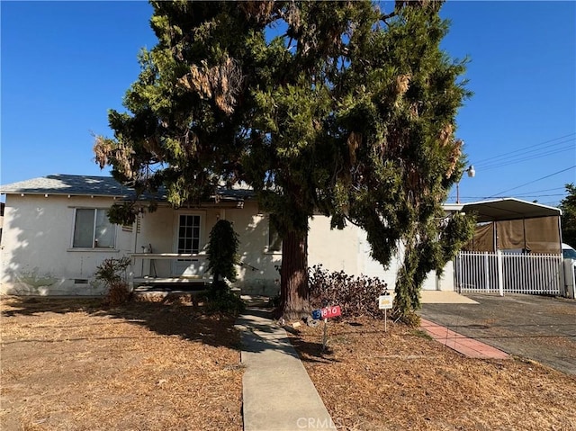 view of front of home with a carport