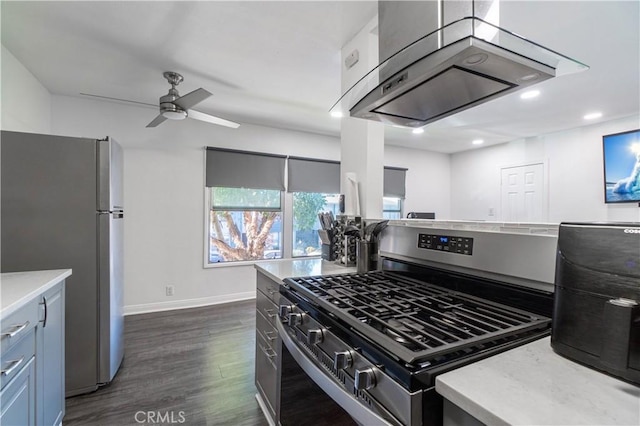 kitchen featuring ceiling fan, dark hardwood / wood-style floors, island range hood, and appliances with stainless steel finishes