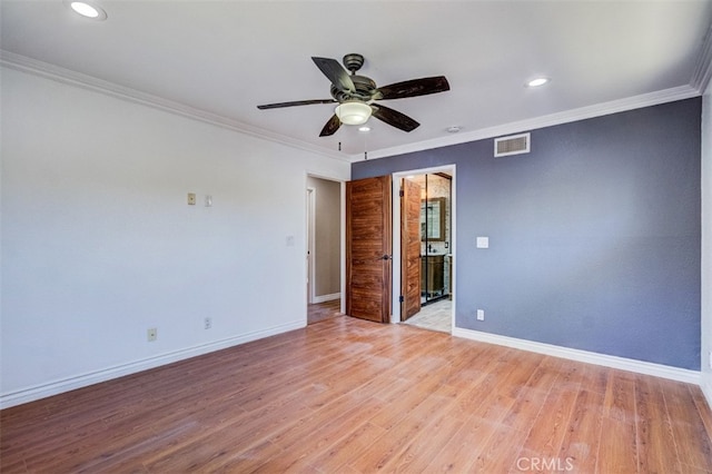 spare room with ceiling fan, light wood-type flooring, and crown molding