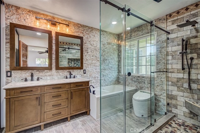 full bathroom with separate shower and tub, ceiling fan, vanity, and a healthy amount of sunlight