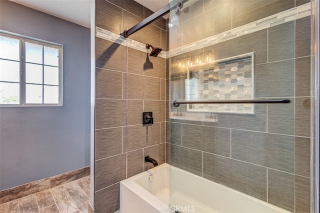 bathroom featuring tiled shower / bath combo