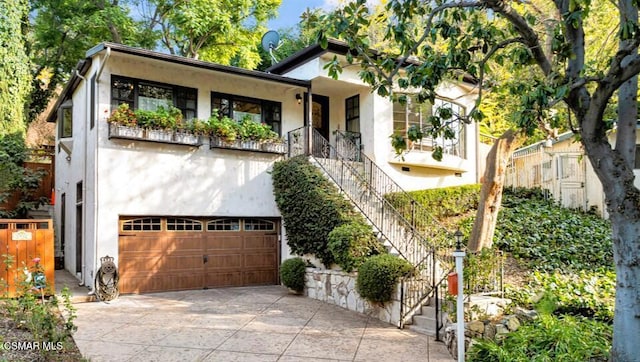 view of front of house with a balcony and a garage