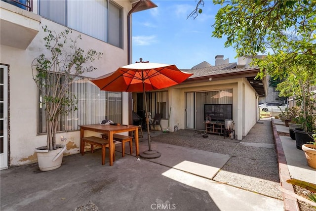 view of patio featuring outdoor dining area