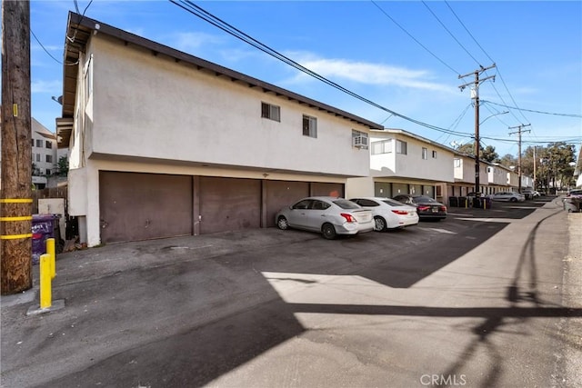 uncovered parking lot featuring a residential view