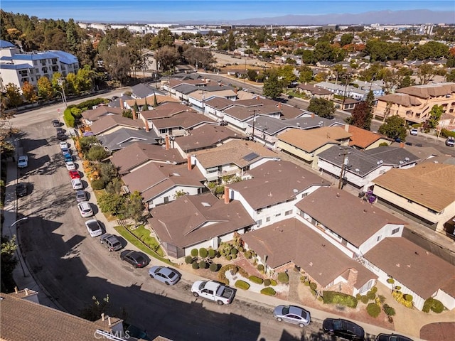 birds eye view of property with a residential view