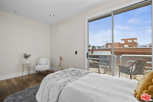 bedroom with hardwood / wood-style flooring