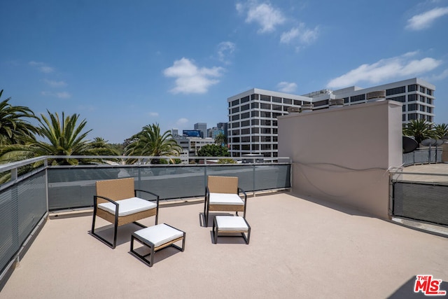 view of patio featuring a balcony