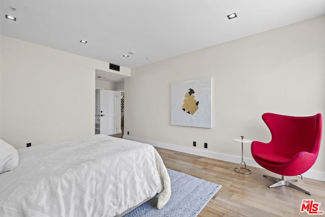 bedroom with light wood-type flooring