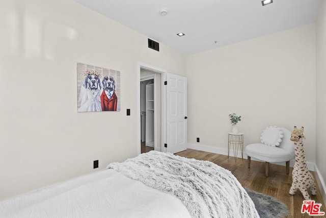 bedroom featuring hardwood / wood-style flooring