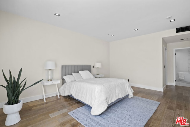 bedroom featuring dark hardwood / wood-style flooring