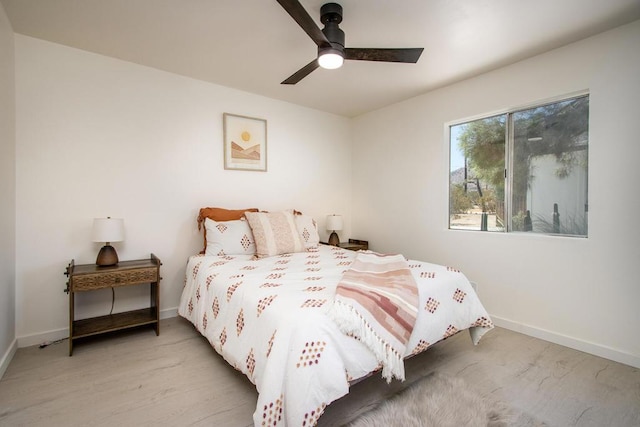 bedroom featuring ceiling fan and light hardwood / wood-style floors