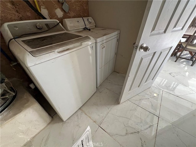 laundry room featuring independent washer and dryer